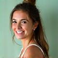 Maria R., a woman in her late 30s with an energetic, positive expression.